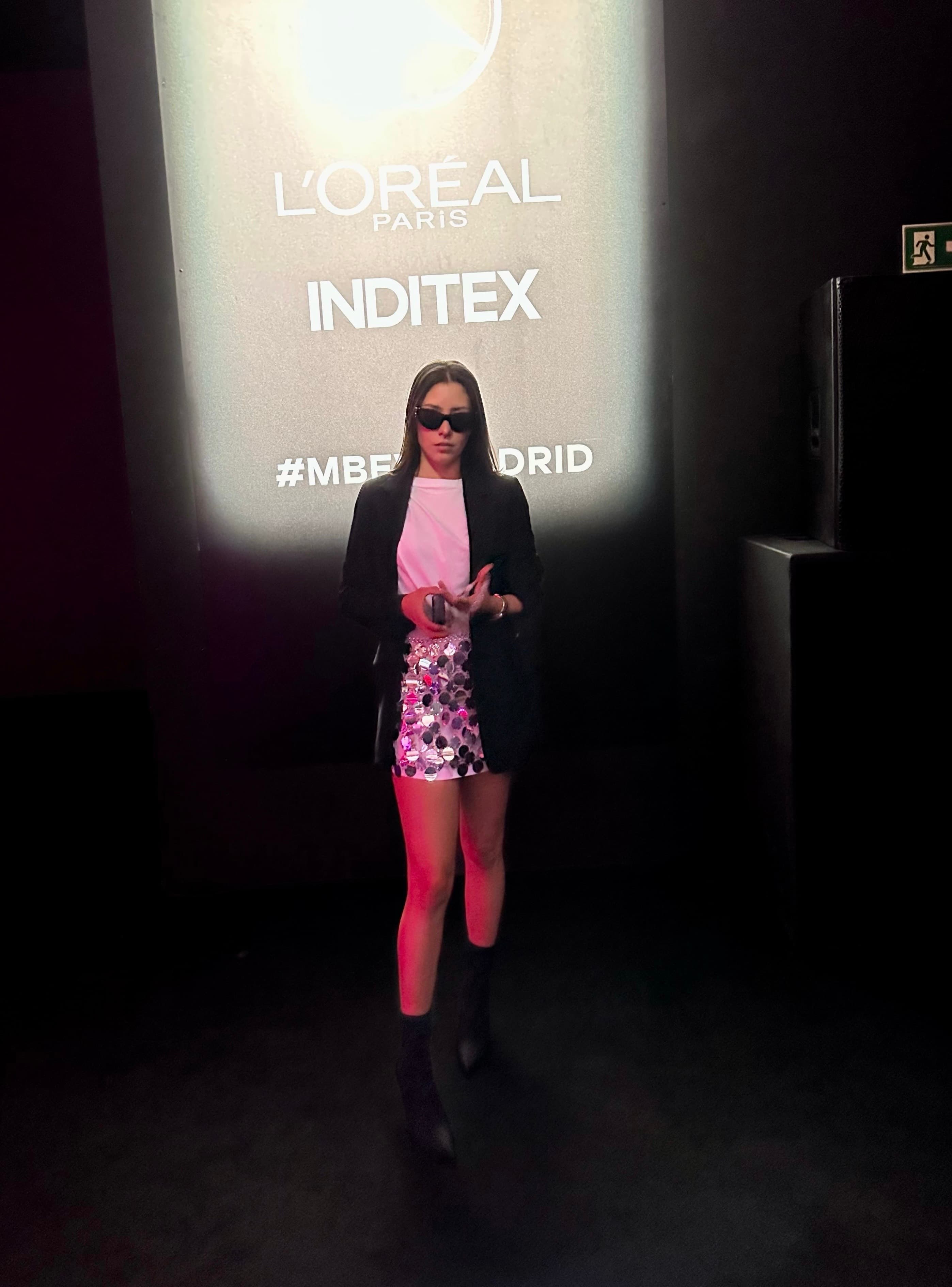 Lu on dark runway stage