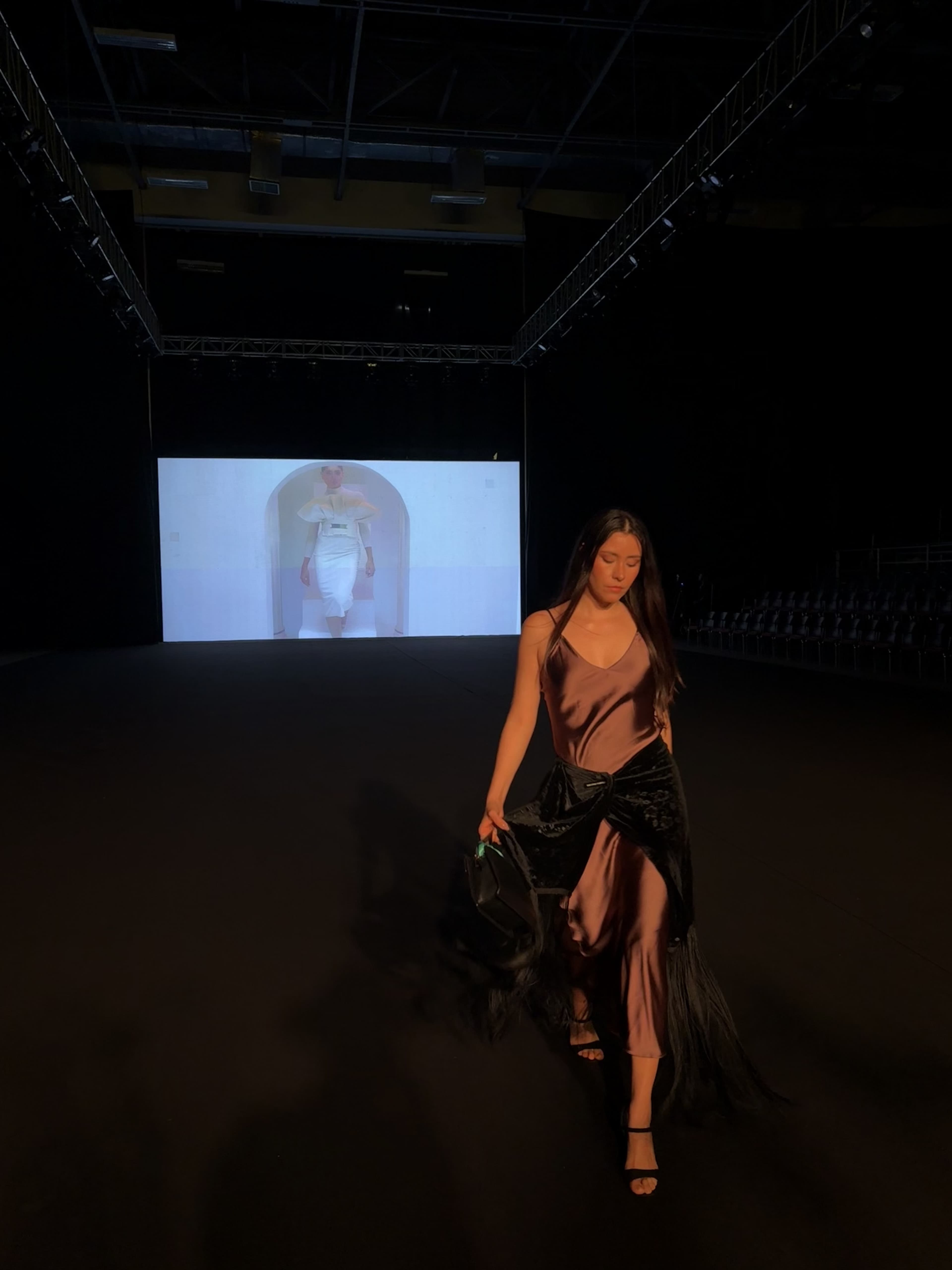 Lu being interviewed at fashion venue